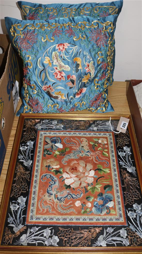 A Chinese silk-embroidered panel (framed) and two similar cushions